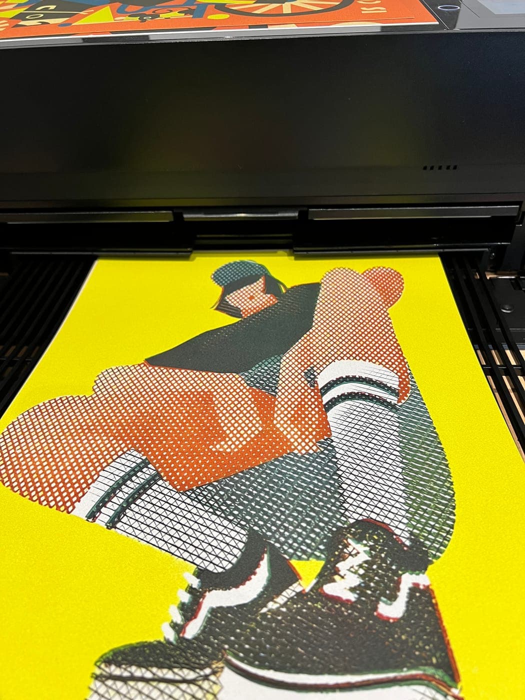 A print coming out of the printer.